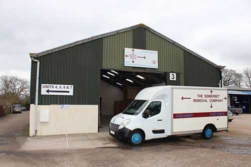 Long angle view of a large Somerset Removal Company van outside their warehouse